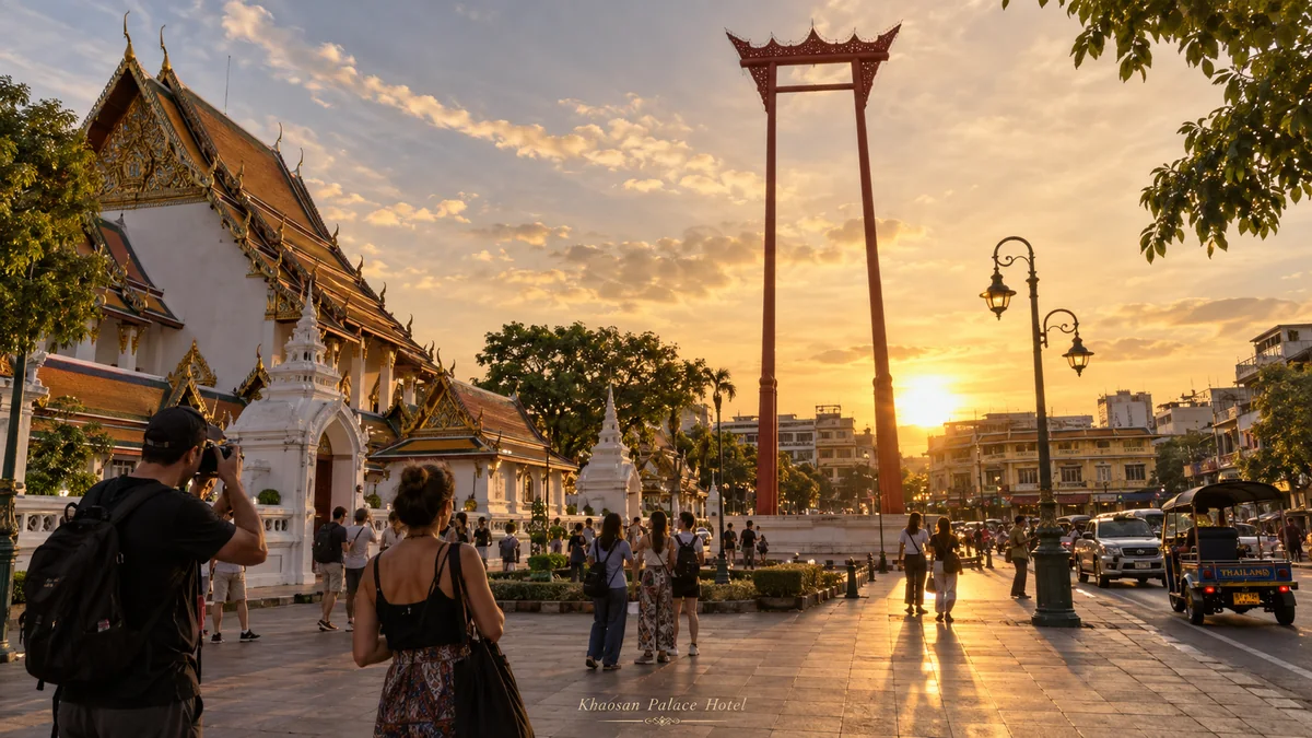Travelers exploring the Giant Swing and Wat Suthat area at sunset