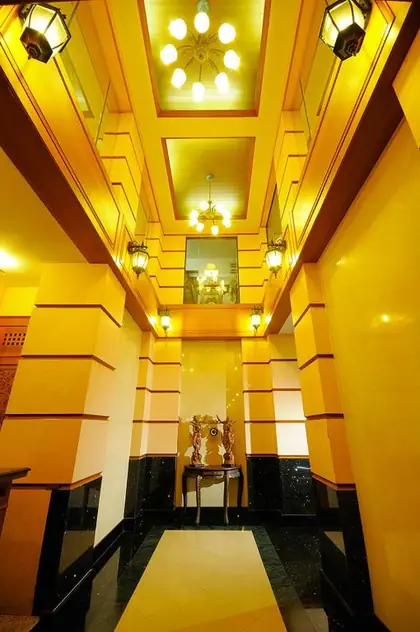 Warm heritage lobby at Khaosan Palace Hotel